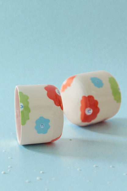 ceramic mug with a pony design and pony tail handle