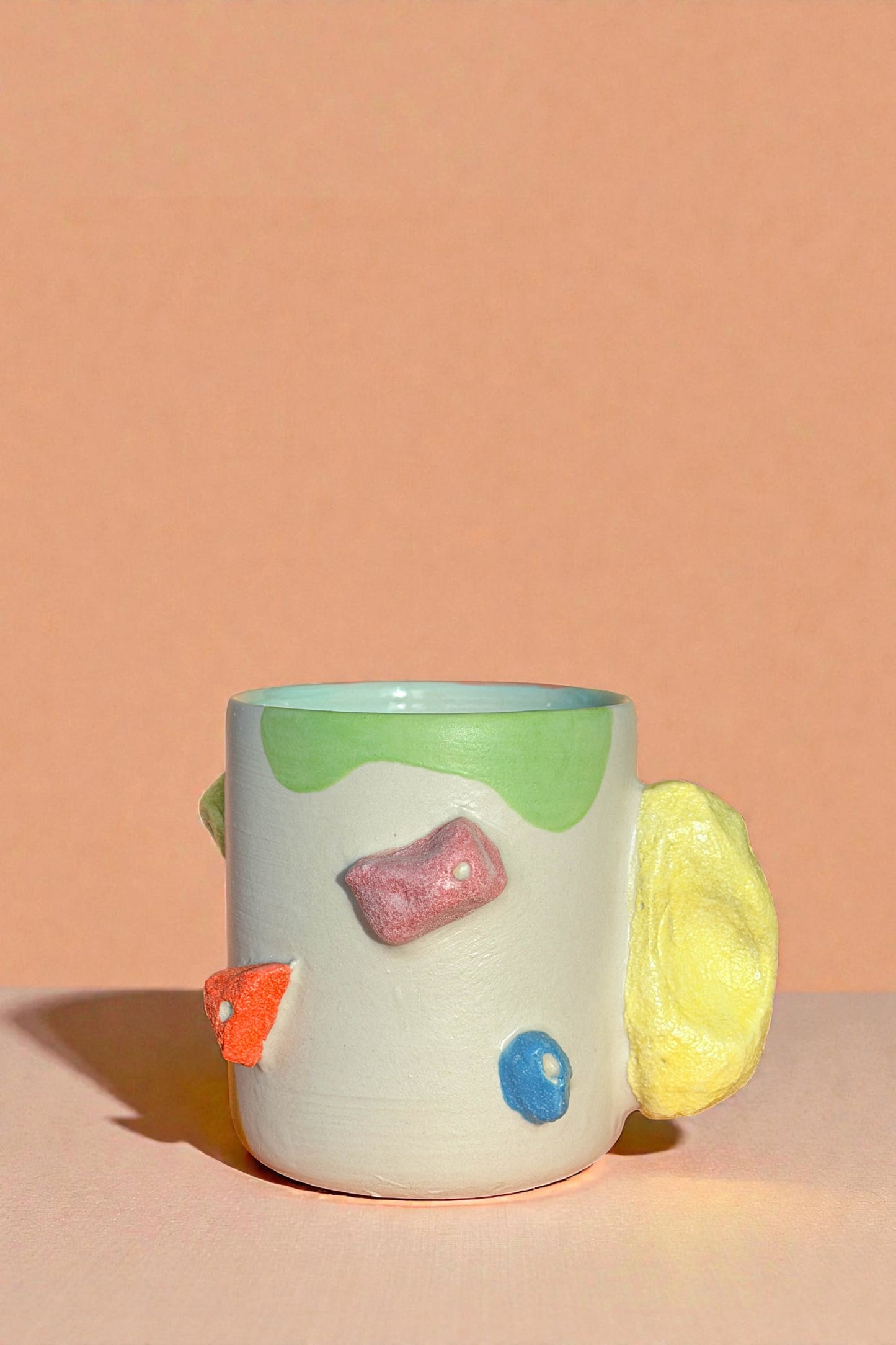 Rocking climbing mug with matte finished galze. The handle mimic rock touch feel